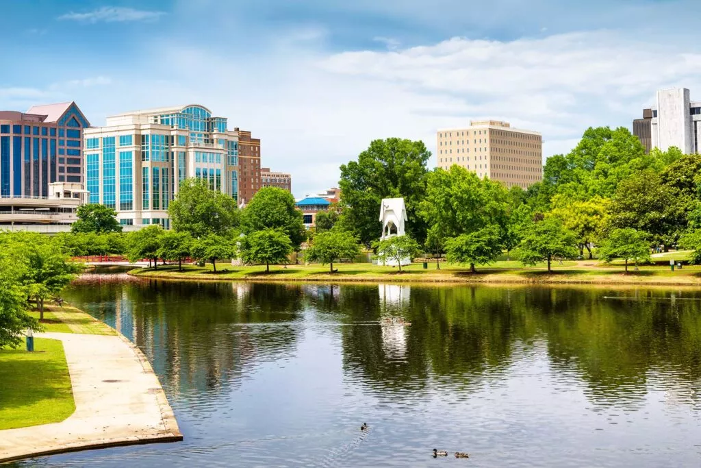 Downtown Huntsville, Alabama skyline at dusk with office towers over the Tennessee Valley in the Rocket City