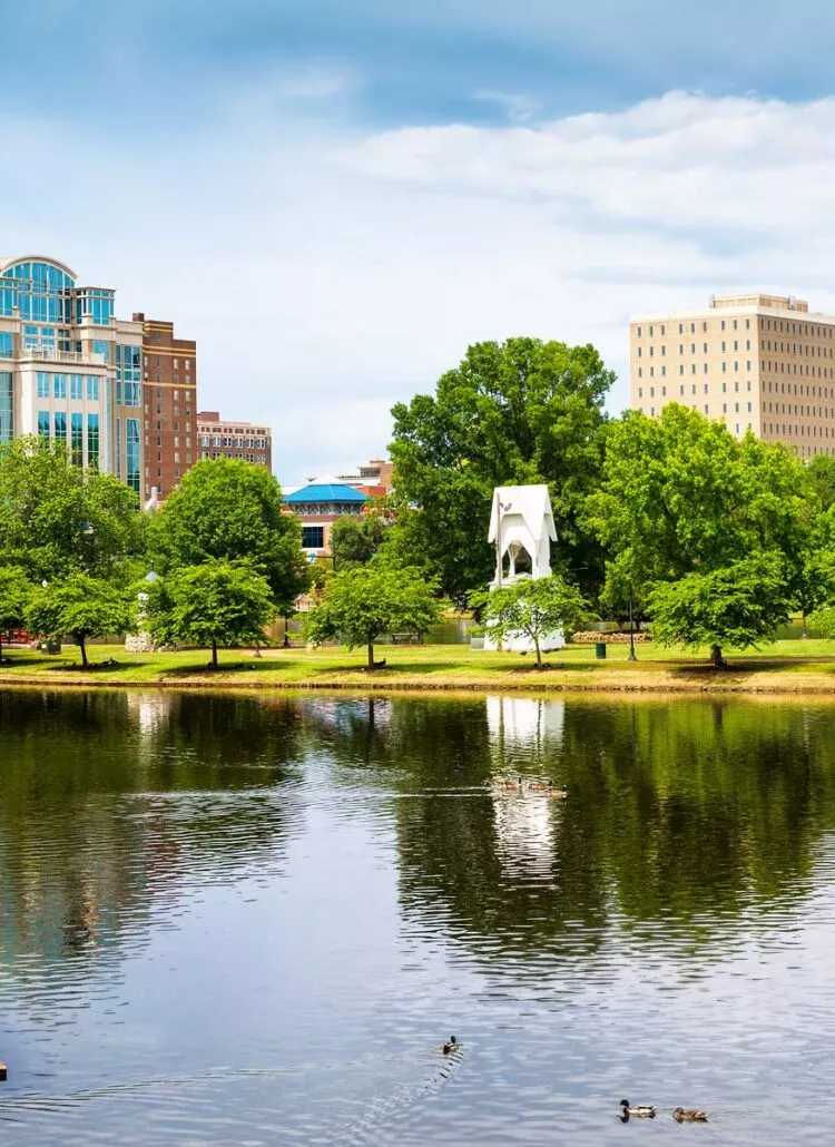 Downtown Huntsville, Alabama skyline at dusk with office towers over the Tennessee Valley in the Rocket City